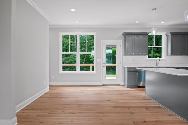 338 Kerry Ln, Soddy Daisy, TN 37379 - kitchen with gray cabinetry, crown molding, light countertops, backsplash, and recessed lighting