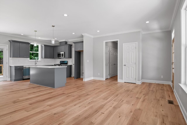 338 Kerry Ln, Soddy Daisy, TN 37379 - kitchen with stainless steel appliances, gray cabinetry, tasteful backsplash, ornamental molding, and a sink
