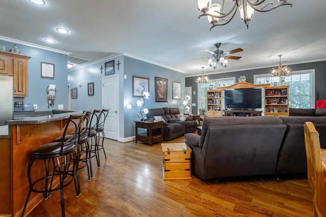 375 Cody Way, Tunnel Hill, GA 30755 - living room featuring a chandelier, wood finished floors, crown molding, ceiling fan, and recessed lighting