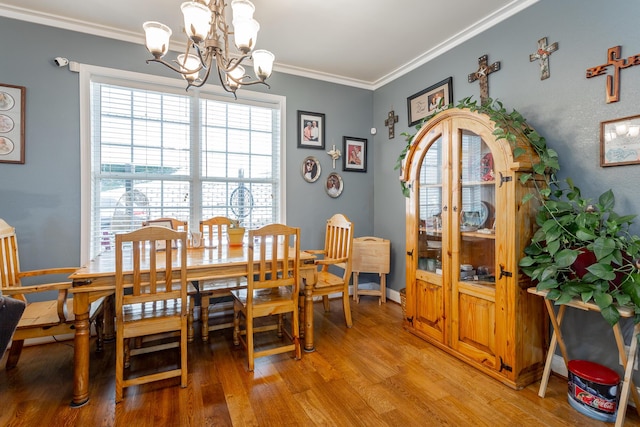 375 Cody Way, Tunnel Hill, GA 30755 - dining area with a chandelier, light wood-type flooring, ornamental molding, and baseboards