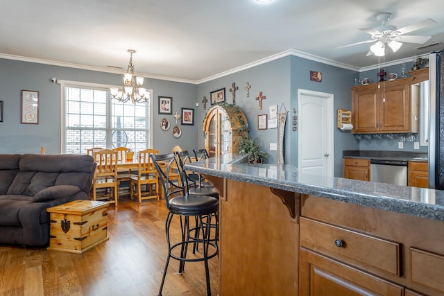 375 Cody Way, Tunnel Hill, GA 30755 - kitchen featuring dishwasher, a breakfast bar, a chandelier, a ceiling fan, and wood finished floors