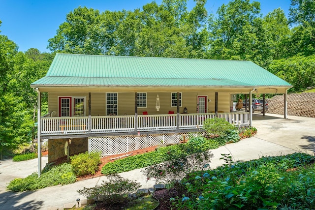 375 Cody Way, Tunnel Hill, GA 30755 - view of front of home featuring covered porch, concrete driveway, a carport, and metal roof