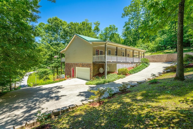 375 Cody Way, Tunnel Hill, GA 30755 - view of front of house featuring a porch, concrete driveway, and an attached garage