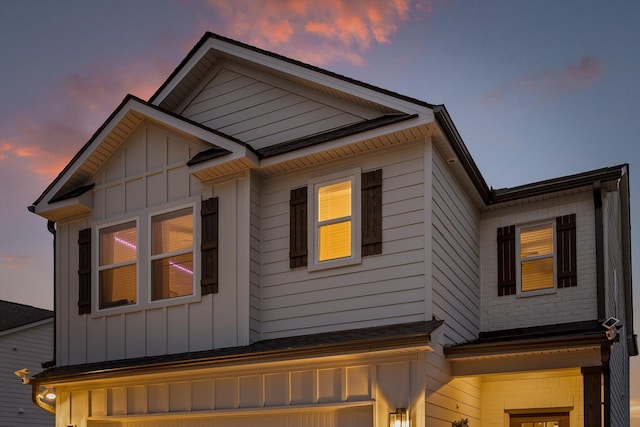 7559 Snow Cone Way, Ooltewah, TN 37363 - view of side of home featuring board and batten siding and an attached garage