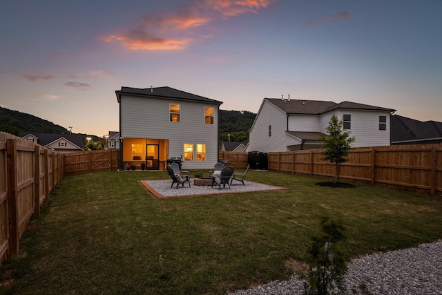 7559 Snow Cone Way, Ooltewah, TN 37363 - back of property featuring a patio and a fire pit
