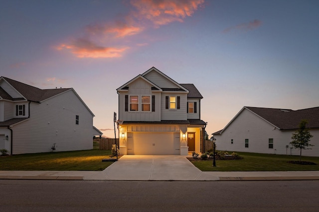 7559 Snow Cone Way, Ooltewah, TN 37363 - craftsman-style house with board and batten siding, driveway, a front yard, and an attached garage