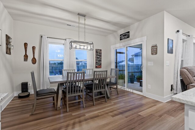 7559 Snow Cone Way, Ooltewah, TN 37363 - dining space featuring wood finished floors, a chandelier, and baseboards