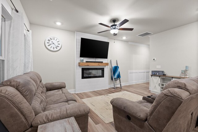 7559 Snow Cone Way, Ooltewah, TN 37363 - living room with a large fireplace, a ceiling fan, light wood-type flooring, recessed lighting, and baseboards