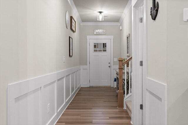 7559 Snow Cone Way, Ooltewah, TN 37363 - doorway with crown molding, wood finished floors, a decorative wall, and wainscoting