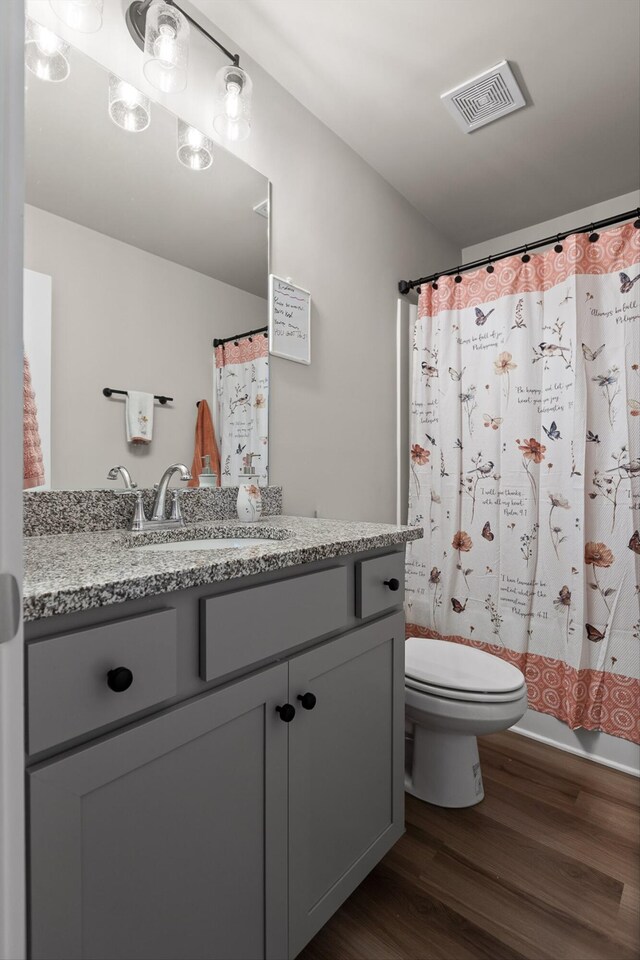 7559 Snow Cone Way, Ooltewah, TN 37363 - bathroom with toilet, wood finished floors, vanity, and a shower with curtain