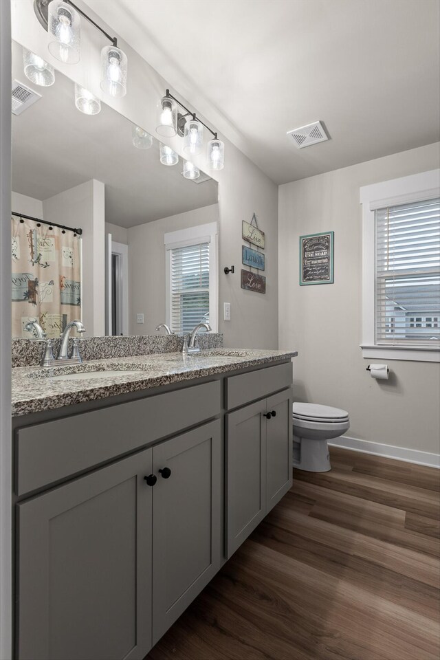 7559 Snow Cone Way, Ooltewah, TN 37363 - bathroom with toilet, wood finished floors, double vanity, and baseboards