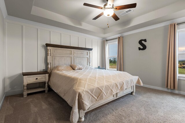 7559 Snow Cone Way, Ooltewah, TN 37363 - carpeted bedroom with a tray ceiling, baseboards, and ceiling fan