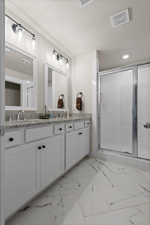 7559 Snow Cone Way, Ooltewah, TN 37363 - bathroom featuring double vanity, a shower stall, marble finish floors, and recessed lighting