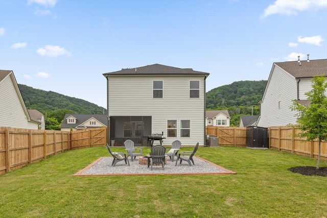 7559 Snow Cone Way, Ooltewah, TN 37363 - back of property featuring central air condition unit, a gate, a patio area, a sunroom, and a mountain view
