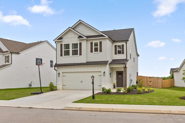 7559 Snow Cone Way, Ooltewah, TN 37363 - view of front facade with board and batten siding, roof with shingles, driveway, and a garage