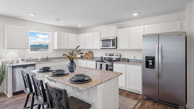 314 Draft St, Rossville, GA 30741 - kitchen featuring stainless steel appliances, a sink, white cabinetry, and recessed lighting