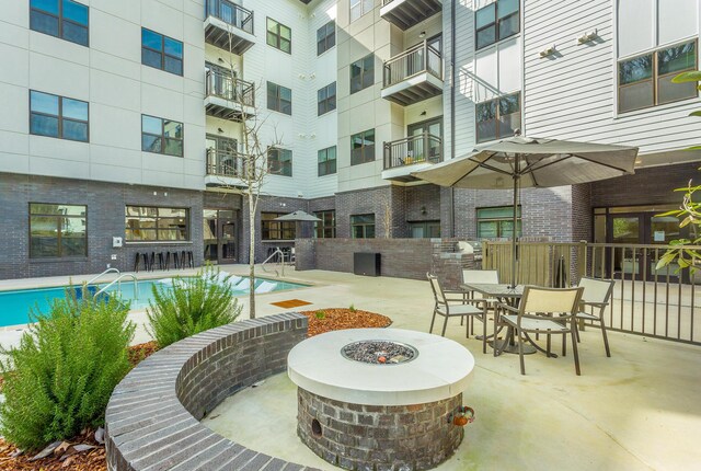 804 Riverfront Pkwy Unit 307, Chattanooga, TN 37402 - community pool with a fire pit and a patio area
