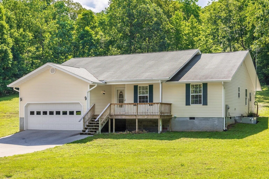 3739 Varnell Ln, Cleveland, TN 37323 - ranch-style house featuring a porch, crawl space, driveway, a garage, and a front yard