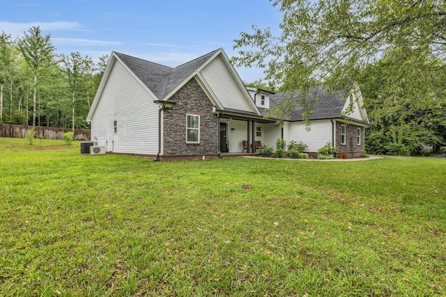 8012 Mcdonald Cemetery Rd, Ooltewah, TN 37363 - view of front of home with stone siding, central AC, and a shingled roof