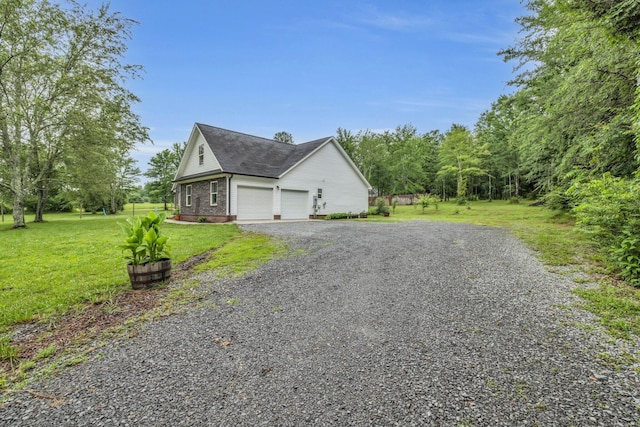 8012 Mcdonald Cemetery Rd, Ooltewah, TN 37363 - view of property exterior with a garage, a yard, a shingled roof, brick siding, and driveway