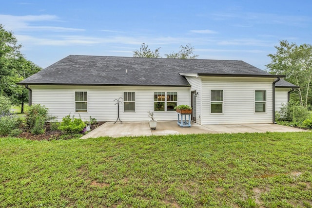 8012 Mcdonald Cemetery Rd, Ooltewah, TN 37363 - back of property with a yard, a patio area, and roof with shingles