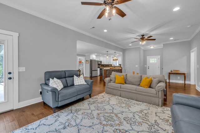 8012 Mcdonald Cemetery Rd, Ooltewah, TN 37363 - living room with ceiling fan, recessed lighting, baseboards, dark wood-style flooring, and ornamental molding