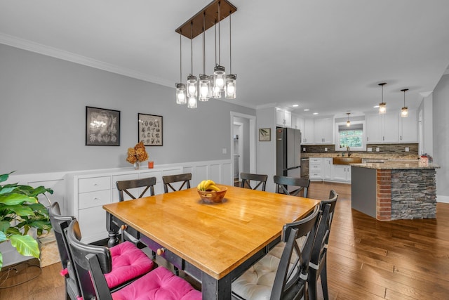 8012 Mcdonald Cemetery Rd, Ooltewah, TN 37363 - dining space with ornamental molding and dark wood-style floors