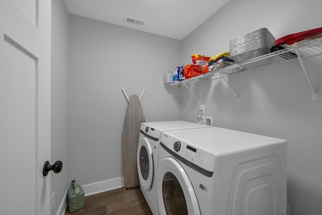 8012 Mcdonald Cemetery Rd, Ooltewah, TN 37363 - laundry room featuring washing machine and clothes dryer, dark wood-style flooring, and baseboards