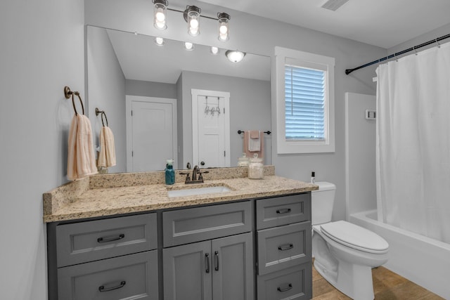 8012 Mcdonald Cemetery Rd, Ooltewah, TN 37363 - bathroom featuring vanity, toilet, shower / bath combination with curtain, and wood finished floors