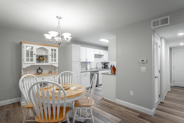 900 Mountain Creek Rd Unit 300, Chattanooga, TN 37405 - dining room featuring a chandelier, baseboards, and wood finished floors