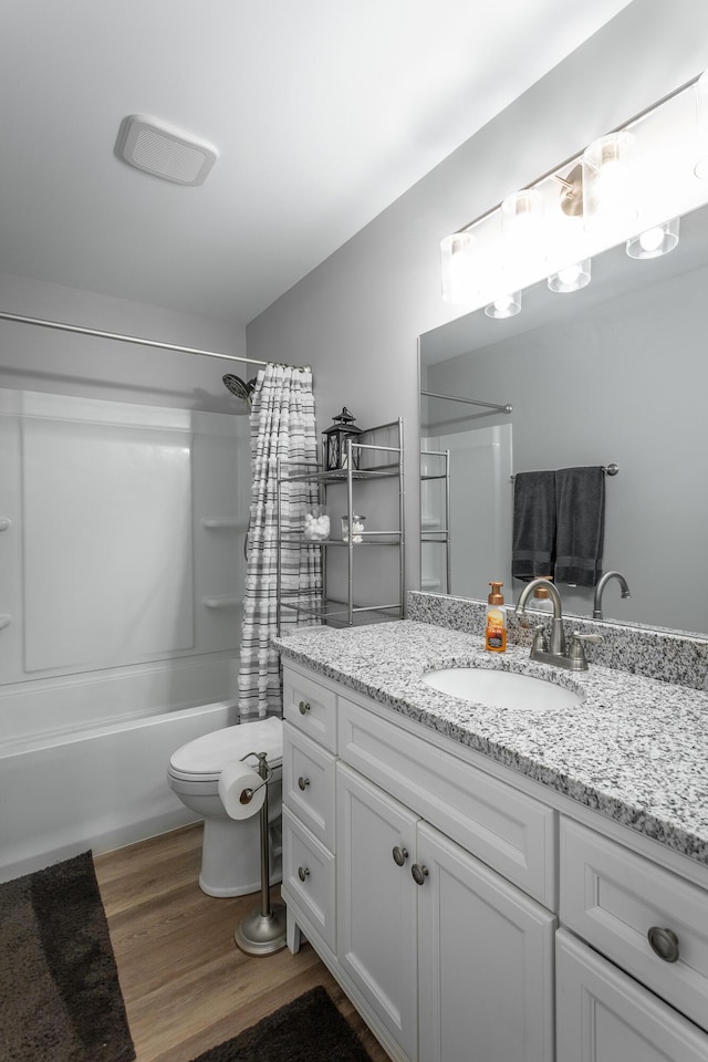 900 Mountain Creek Rd Unit 300, Chattanooga, TN 37405 - full bathroom featuring vanity, toilet, wood finished floors, and shower / bath combo with shower curtain