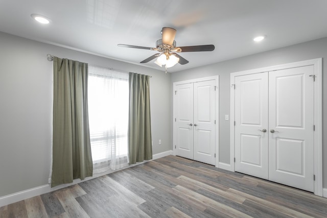 900 Mountain Creek Rd Unit 300, Chattanooga, TN 37405 - unfurnished bedroom featuring multiple closets, wood finished floors, baseboards, recessed lighting, and a ceiling fan
