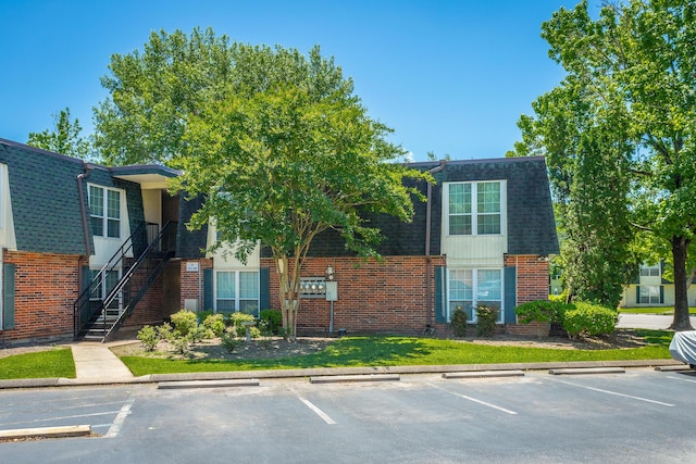 900 Mountain Creek Rd Unit 300, Chattanooga, TN 37405 - view of property featuring uncovered parking and stairway