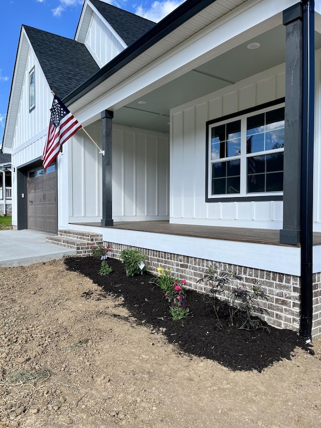 4958 Old State Highway 28, Dunlap, TN 37327 - view of side of property with board and batten siding, a shingled roof, a porch, and driveway