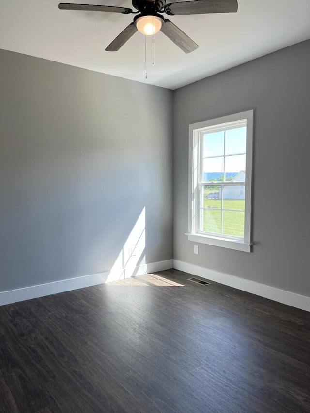 4958 Old State Highway 28, Dunlap, TN 37327 - unfurnished room with baseboards, a ceiling fan, and dark wood finished floors