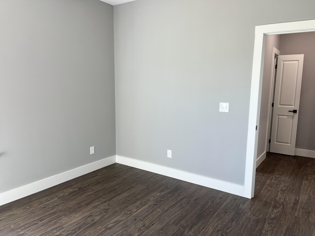 4958 Old State Highway 28, Dunlap, TN 37327 - unfurnished room with baseboards and dark wood-type flooring