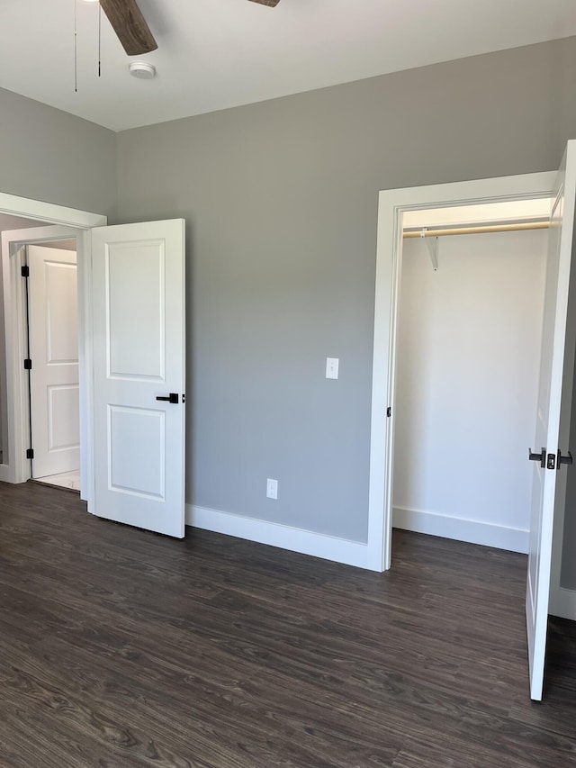 4958 Old State Highway 28, Dunlap, TN 37327 - unfurnished bedroom with baseboards, dark wood-style flooring, a closet, and a ceiling fan