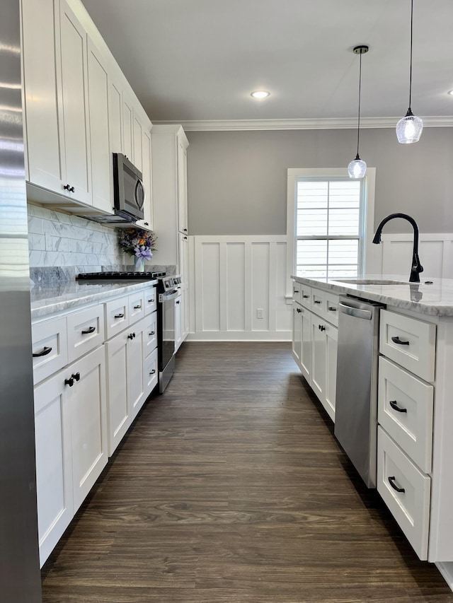 4958 Old State Highway 28, Dunlap, TN 37327 - kitchen with appliances with stainless steel finishes, crown molding, white cabinetry, a sink, and backsplash