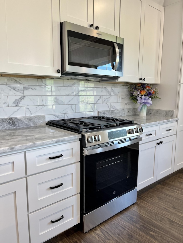 4958 Old State Highway 28, Dunlap, TN 37327 - kitchen featuring appliances with stainless steel finishes, white cabinets, light stone countertops, and tasteful backsplash