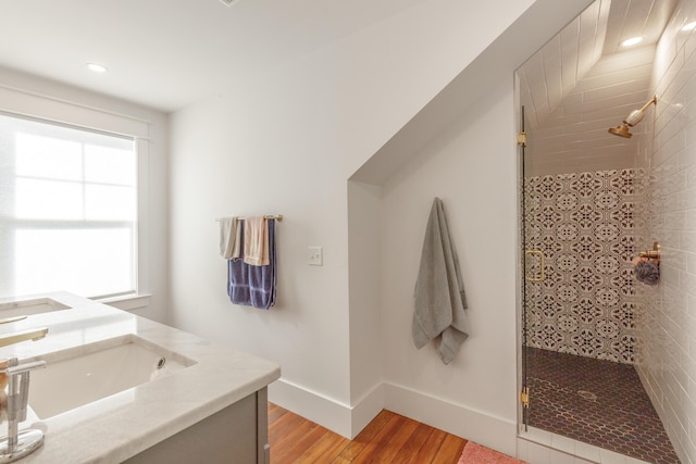 2104 Oak St, Chattanooga, TN 37404 - full bath featuring wood finished floors, a shower stall, double vanity, recessed lighting, and baseboards