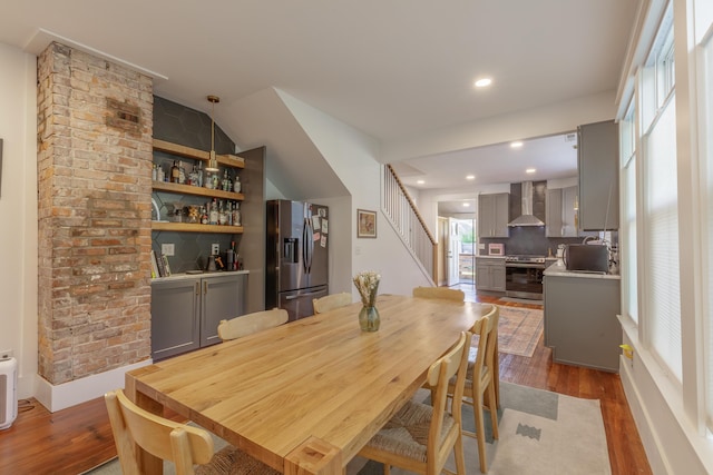 2104 Oak St, Chattanooga, TN 37404 - dining space with wood finished floors, stairs, recessed lighting, and a bar