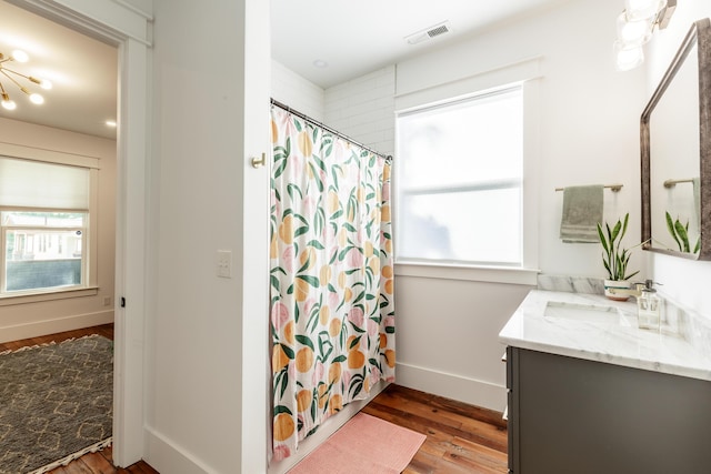 2104 Oak St, Chattanooga, TN 37404 - bathroom featuring vanity, wood finished floors, a shower with curtain, and baseboards
