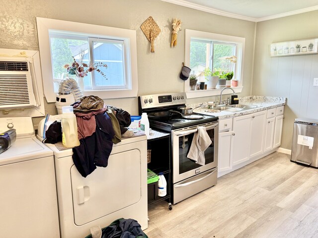 1812 E 13th St, Chattanooga, TN 37404 - kitchen featuring electric range, light wood-style floors, crown molding, white cabinets, and light countertops