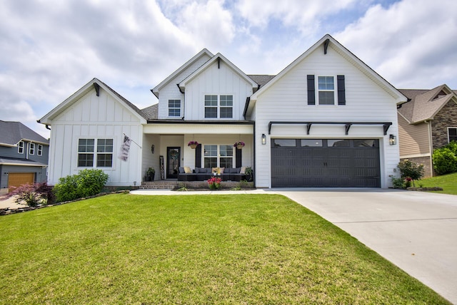 9117 Sir Hudson Ct, Harrison, TN 37341 - modern farmhouse with board and batten siding, a porch, concrete driveway, a garage, and a front lawn