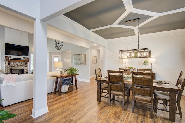 9117 Sir Hudson Ct, Harrison, TN 37341 - dining space featuring wood finished floors, a fireplace, and baseboards