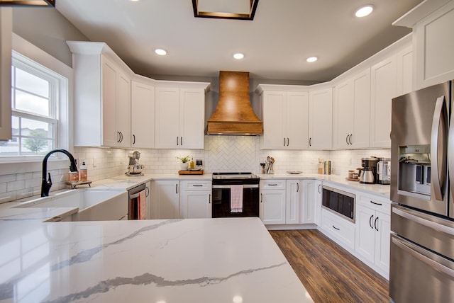 9117 Sir Hudson Ct, Harrison, TN 37341 - kitchen with appliances with stainless steel finishes, premium range hood, a sink, white cabinets, and recessed lighting