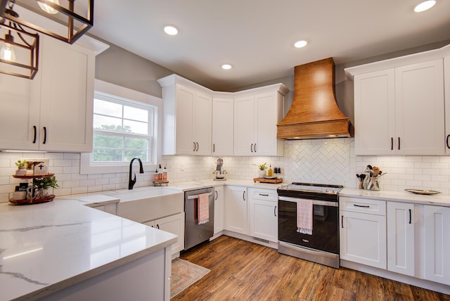 9117 Sir Hudson Ct, Harrison, TN 37341 - kitchen with appliances with stainless steel finishes, custom range hood, white cabinets, dark wood-style flooring, and light stone counters