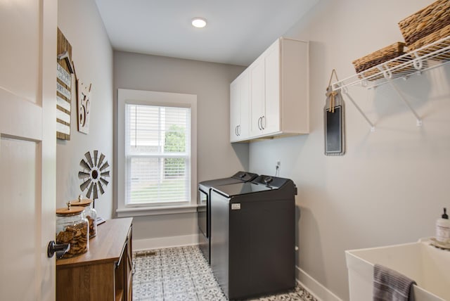 9117 Sir Hudson Ct, Harrison, TN 37341 - laundry room with baseboards, cabinet space, washer and dryer, light floors, and recessed lighting