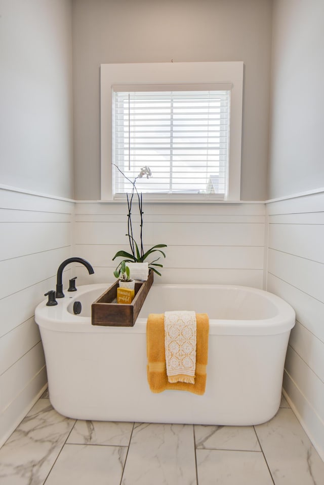 9117 Sir Hudson Ct, Harrison, TN 37341 - bathroom featuring marble look tile flooring and a freestanding tub
