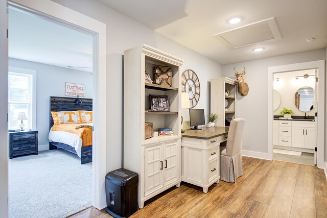 9117 Sir Hudson Ct, Harrison, TN 37341 - home office with attic access, light wood finished floors, baseboards, and a sink